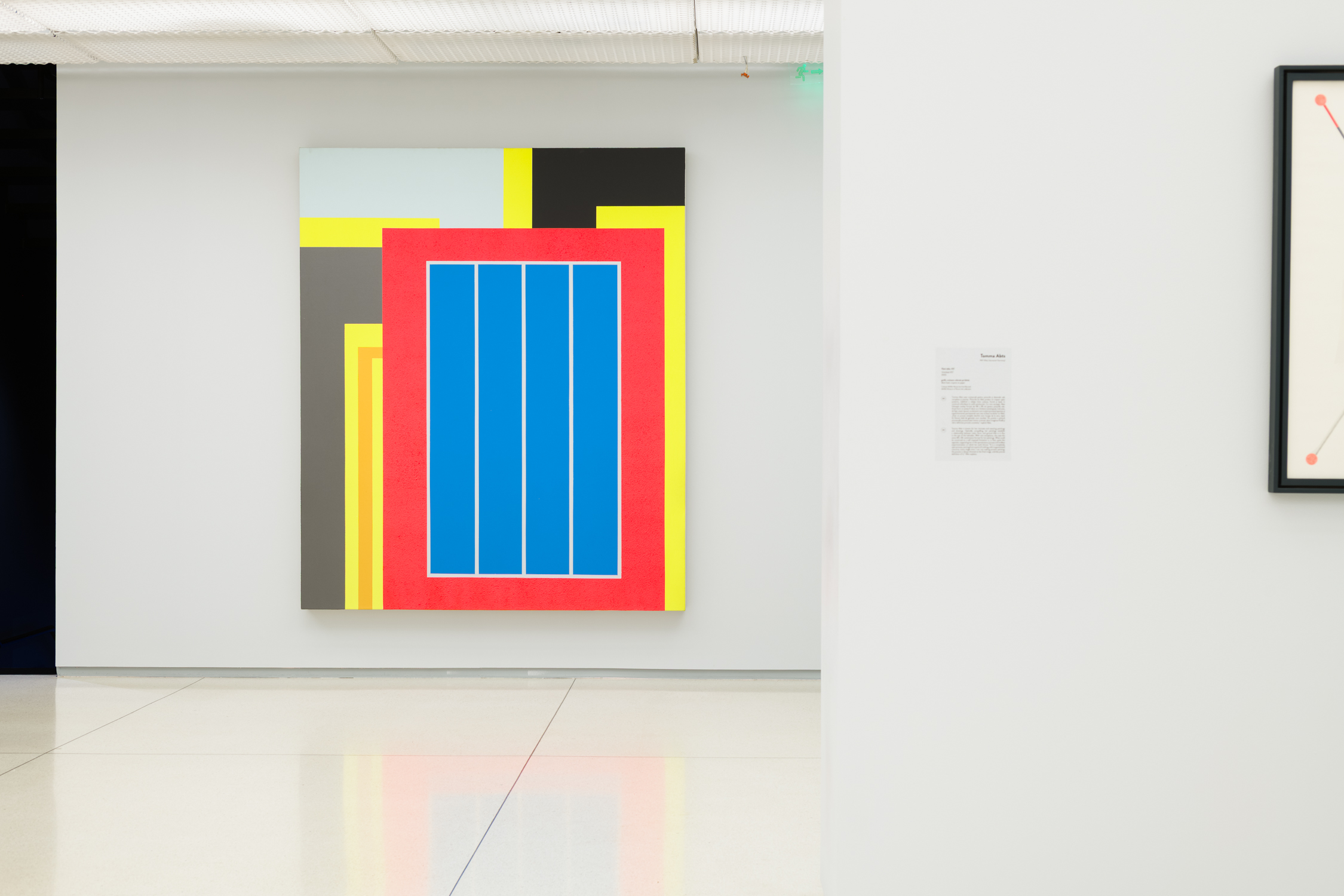 Geometric abstract painting with bold blue and red shapes
